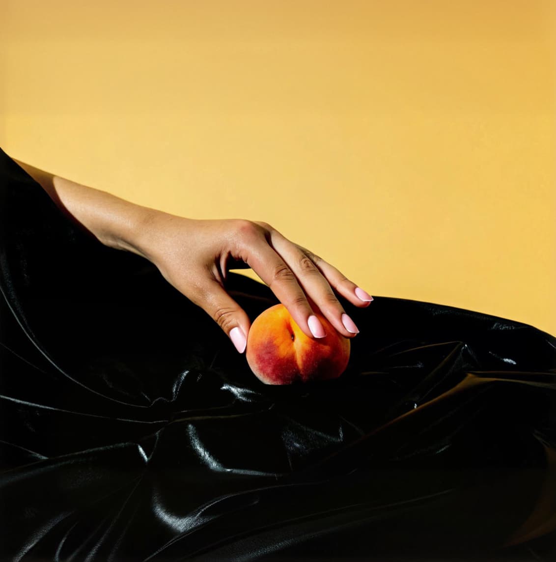 Background image of a hand holding a peach